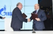 Sergey Polyakov, Director General of Foundation for Assistance to Small Innovative Enterprises (FASIE), and Oleg Aksyutin signing Agreement for scientific and technical cooperation and partnership at 7th St. Petersburg International Gas Forum
