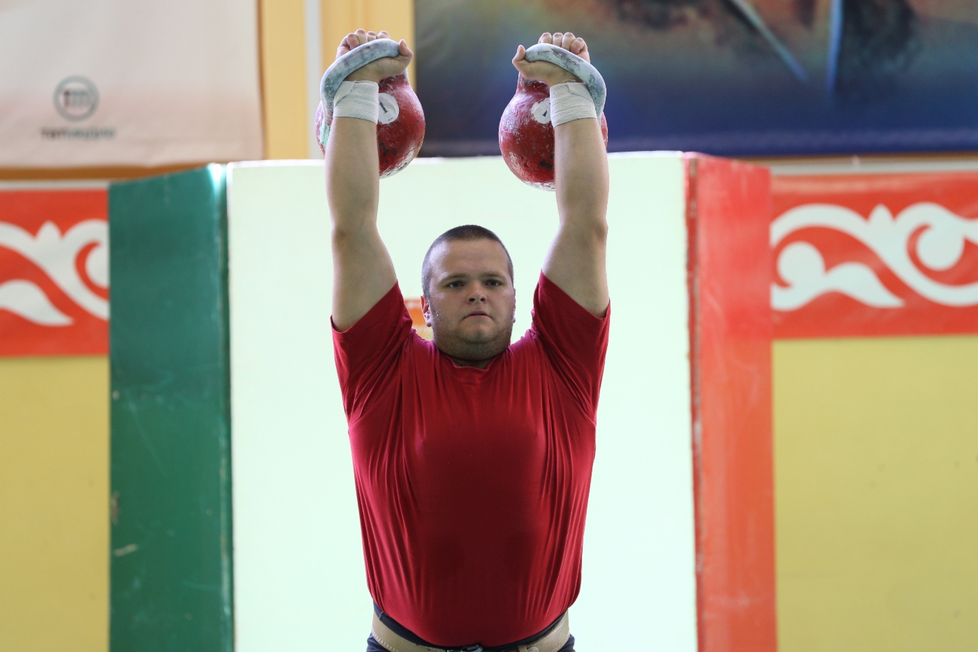 Kettlebell lifting competition. Weight category “90+ kilograms”