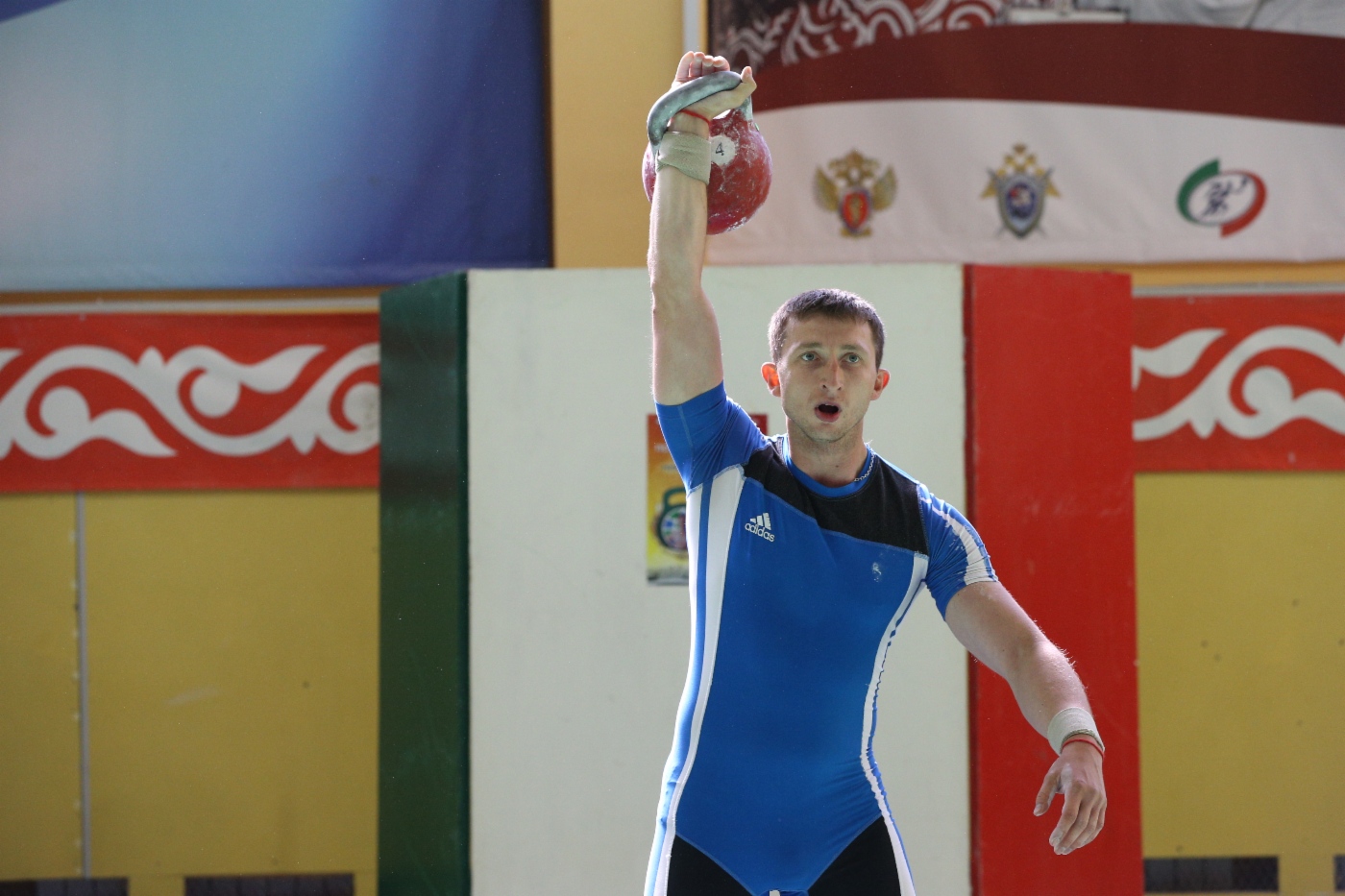 Kettlebell lifting competition. Weight category “90+ kilograms”