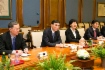Jiang Jianqing (second from left) at working meeting with Alexey Miller