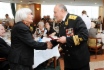 Bagrat Knyazchan, committee deputy chairman of National Public Organization of War and Military Service Veterans hands memorable gift to Galina Gulyaeva, May 5, 2011