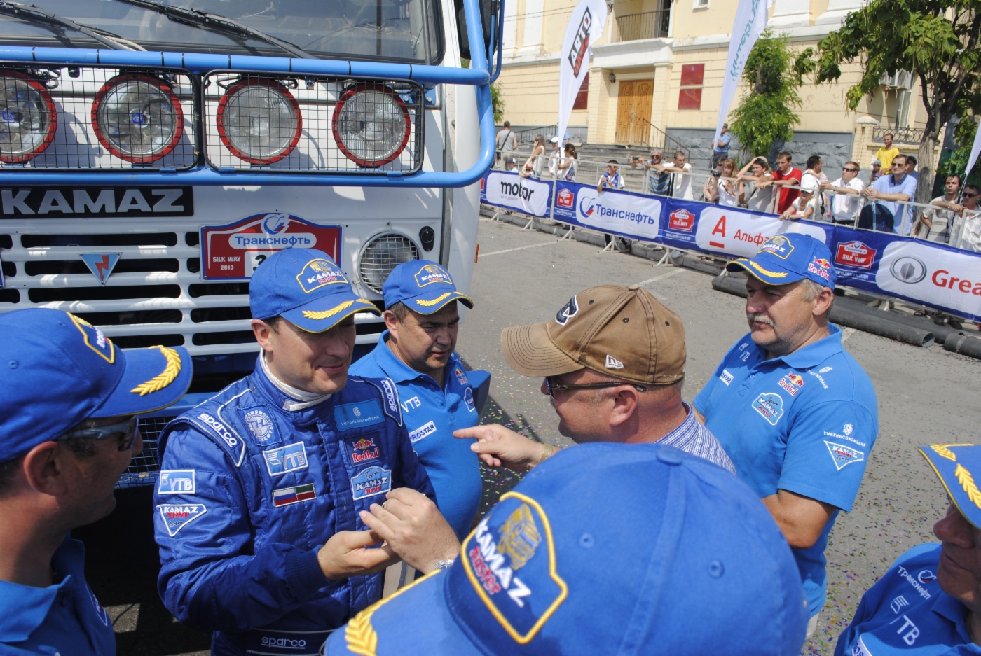 Team of Gas-fueled KAMAZ receiving congratulations of successful completion of race